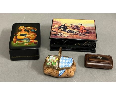 Two lacquered boxes, wooden snuff box and a Limoge porcelain basket 