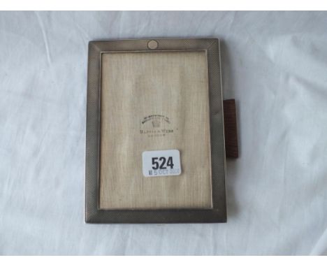 An oblong photo frame with engine turned border - 6.5" high - London 1923 by M&amp;W