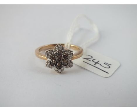 A diamond cluster dress ring in 9ct - size K - 3gms