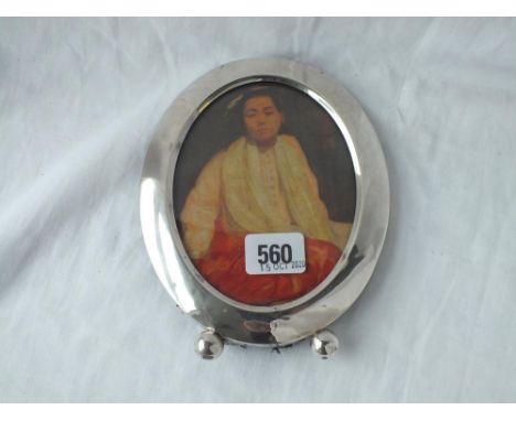 An oval sterling silver photo frame retailed by MACY &amp; Co - 7" high