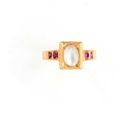 MOONSTONE, RUBY AND GOLD RING, 1900s centring with an oval moonstone cabochon within a bright-cut bezel, the shoulders accent