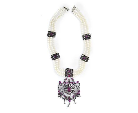 RUBY AND DIAMOND NECKLACE supporting and open work shield shaped pendant set with oval and circular rubies and single-cut and
