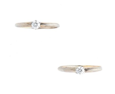 TIFFANY & CO.: TWO DIAMOND RINGS each centring on a single brilliant-cut diamond, signed Tiffany &amp; Co, ring size K 1/2, w