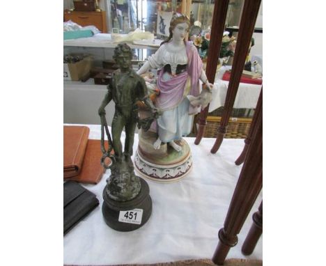 A ceramic figure and a metal figure
