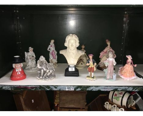 A shelf of assorted figure and a bust etc