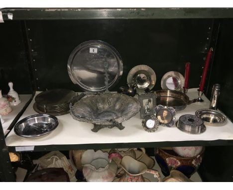 A shelf of metalware