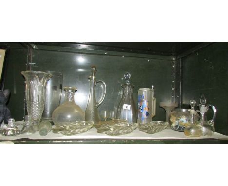 A shelf of glass ware