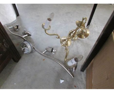 A brass ceiling light and a bank of spot lights