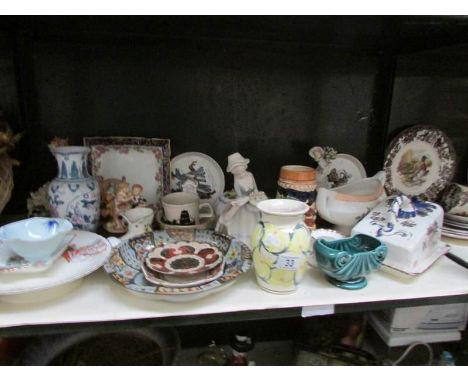 A shelf of miscellaneous china