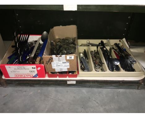 A shelf of assorted cutlery