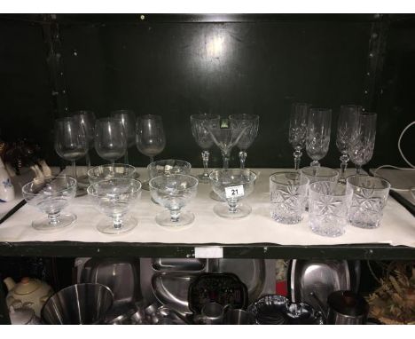 A shelf of glass ware
