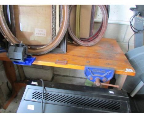 A work bench with attached vices