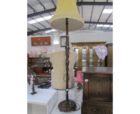 A standard lamp with shade