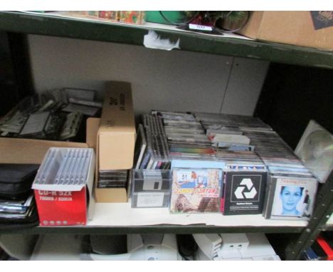 A shelf of assorted CD's