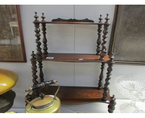 A mahogany wall shelf