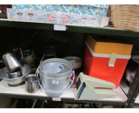 A shelf of kitchen ware