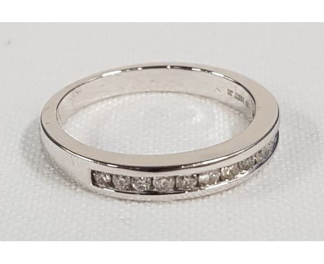 18CT WHITE GOLD CHANNEL SET DIAMOND RING WITH 0.25 CARAT OF DIAMOND