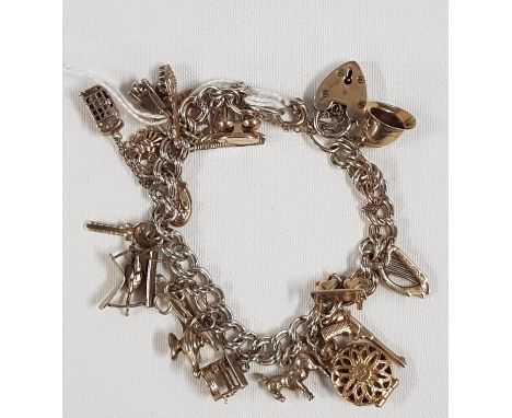 SILVER CHARM BRACELET WITH ALL 9CT GOLD CHARMS