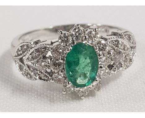 EMERALD &amp; DIAMOND RING IN WHITE GOLD