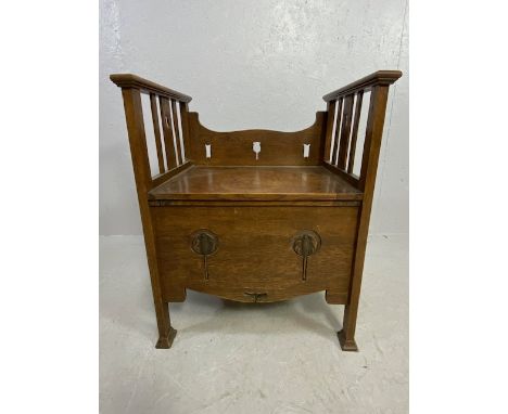 Arts and Crafts commode chair with carvings and pierced decoration and original ceramics 