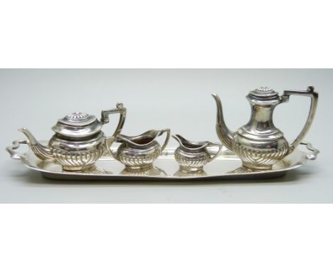 A hallmarked silver miniature doll's house tea service and tray, 66g, tray 14.5cm
