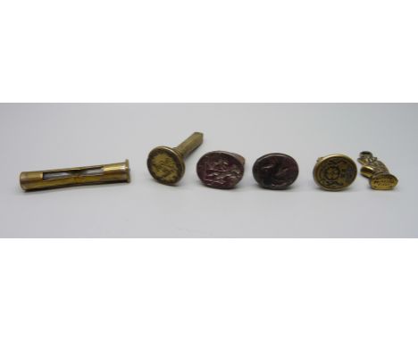 Four seals, a brass timer and a Polperro Pisky charm