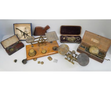 A collection of jewellers balance scales and postal scales 