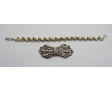A silver and marcasite double clip brooch and a silver, marcasite and pearl bracelet, 46g