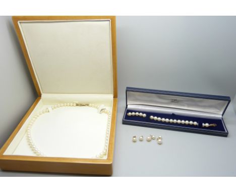 A cultured pearl necklace, bracelet and two pairs of pearl earrings, all 9ct gold mounted, the pearl bracelet certificate, gr