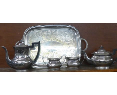 A four piece EP on brass tea service, Viners of Sheffield and a plated two handled serving tray