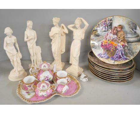 A large collection of bone china plates and display mounts with a miniature pink tea service and four figures and eight frame
