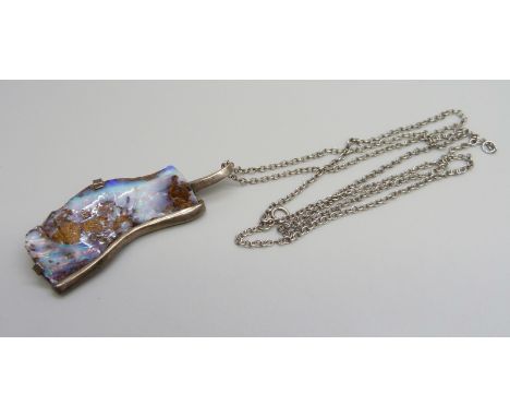 A silver mounted large rough opal studio pendant on a silver chain, opal 45mm