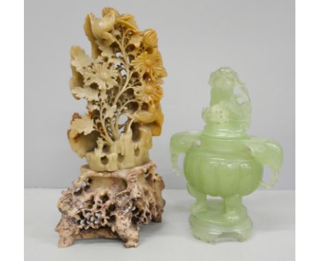A soapstone carving and a resin jade coloured jar and cover 