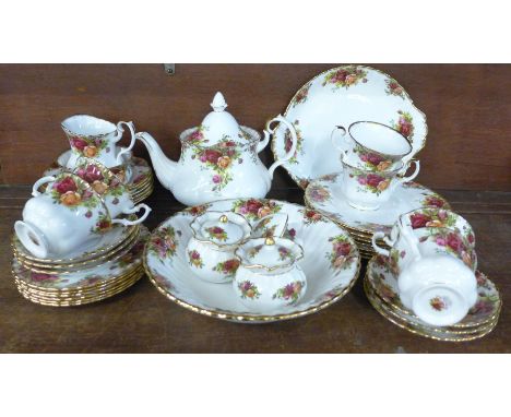A six setting Royal Albert Old Country Roses china tea service with bread and butter plate, two pots and posy ornaments **PLE