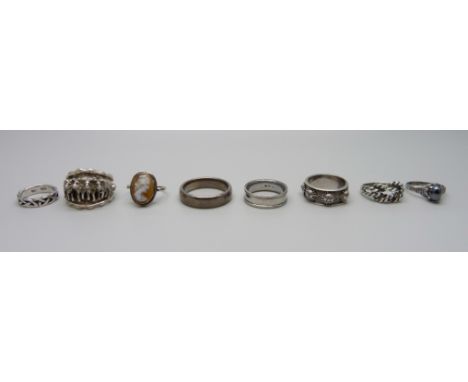 Seven silver rings and a titanium ring 