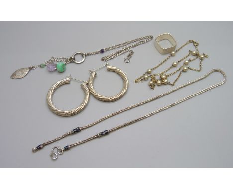A designer silver and enamel necklace, MVA Birmingham, large silver hoop earrings, a silver ring and a silver and pearl set n