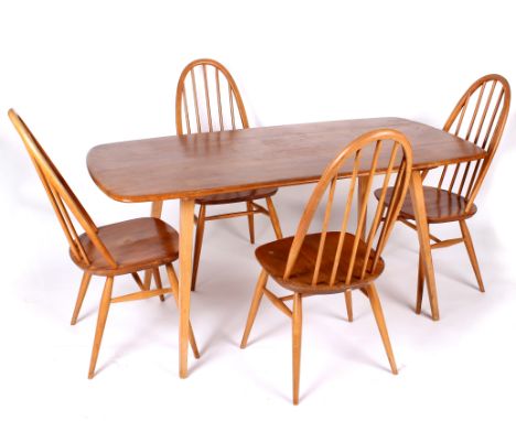 An Ercol elm dining table and set of four dining chairs 