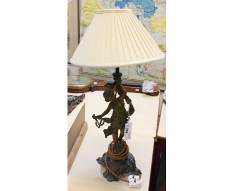 A figural spelter lamp with cream shade (sold as parts) 