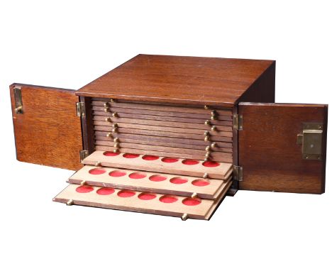 The wooden coin cabinet by St Leonards in which the collection was housed, 30 x 29 x 17cm, comprising 14 trays single-pierced