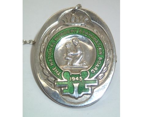 Hallmarked silver nursing badge for the National Nursery Examination Board 1945. P&amp;P group 1 (£16 for the first item and 
