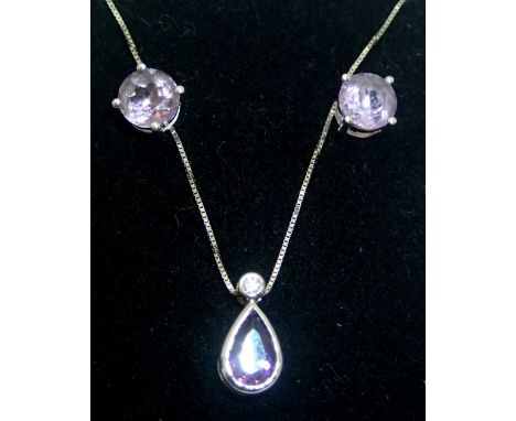18ct gold amethyst set earrings and pendant set 4.3g. P&amp;P group 1 (£16 for the first item and £1.50 for subsequent items)
