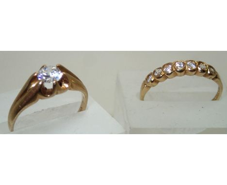 Two 9ct gold rings set with white stones size O. The multi stone ring has one stone turned 4.1g. P&amp;P group 1 (£16 for the