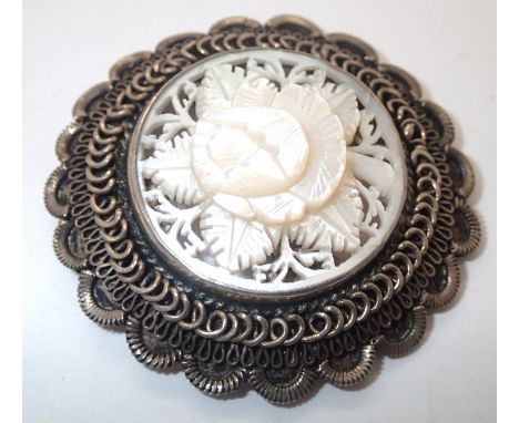 Sterling silver mounted carved mother of pearl brooch D: 50mm. P&amp;P group 1 (£16 for the first item and £1.50 for subseque