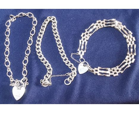 Two sterling silver charm style bracelets together with a silver gate style bracelet 34.5g. P&amp;P group 1 (£16 for the firs