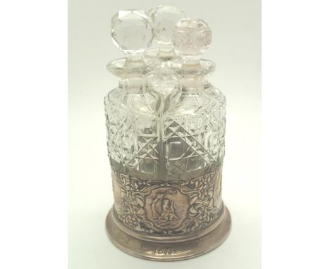 Hallmarked silver three bottle cruet with lue player panel, one replacement stopper, Chester hallmark,, H: 16 cm. P&amp;P gro