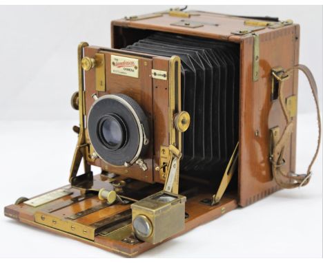 Sanderson Quarter Plate Tropical Hand &amp; Stand Camera from around 1910 in Teak.  It has an Wollensak Optical Co Optimo Shu