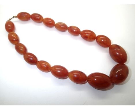String of mottled amber beads largest L:31 mm in good condition 54g. P&amp;P group 1 (£16 for the first item and £1.50 for su