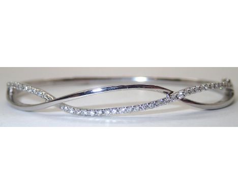 9ct white gold and diamond bangle D: 67 mm 12.0g. P&amp;P group 1 (£16 for the first item and £1.50 for subsequent items) 