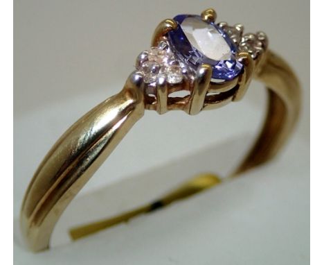 Ladies 9ct gold, tanzanite and diamond ring size S. P&amp;P group 1 (£16 for the first item and £1.50 for subsequent items) 