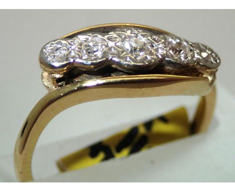 18ct gold antique five stone on a twist diamond ring size J. P&amp;P group 1 (£16 for the first item and £1.50 for subsequent